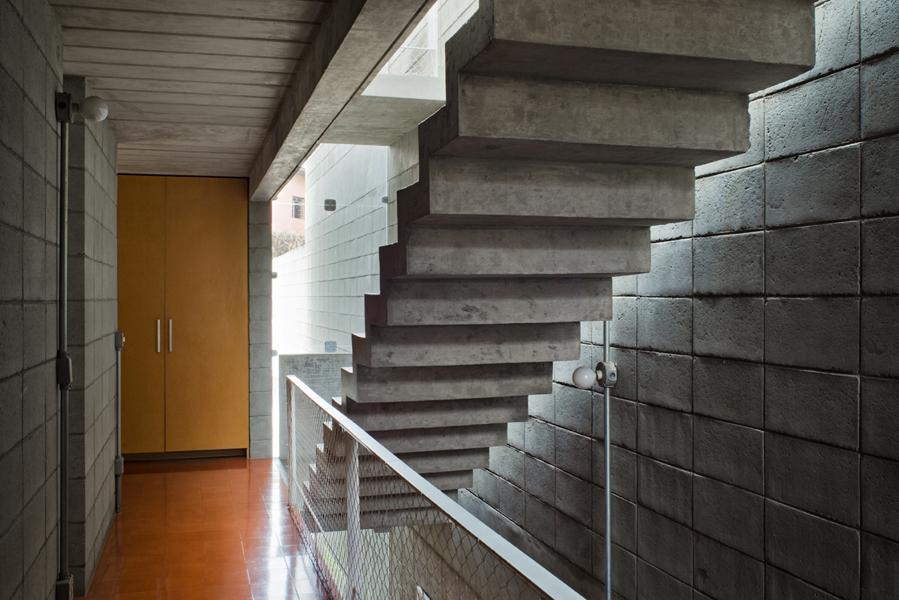 3 storey wall books creates privacy contemporary home 9 stairs